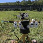 Sensors deployed in the field in a transect of three positions. Placing sensors in a transect allows for capture of unique “zones of influence” within the array, such as the different effect created by the dripline of the panel versus the reduced rainfall received underneath the impervious panel. The transect is also used in the control area of the study so that in-field variation is equally captured. 