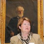 Kay Stockbridge, family historian with portrait of Levi Stockbridge
