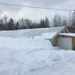 A tunnel covered with snow.