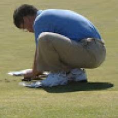 Dr. Geunhwa Jung takes soil samples on organic golf course