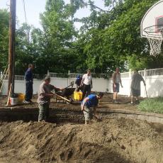 Residents of Hector Reyes House cover contamintated soil with healthy soil
