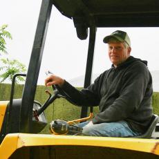 Keith Lilly helps to manage cattle and compost