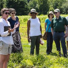 Extension Educator Sue Scheufele describes her project to guests.