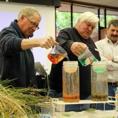 Participants add water to soil