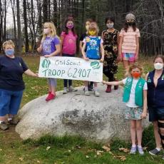 Girl Scout Troop and leader plant trees 