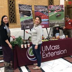 Extension Climate Adaptation Coordinator Melissa Ocana and Samantha Corcoran-Glaze, doctoral student in plant biology, at the Extension booth at Ag Day.