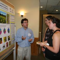 Justin Roch explains methods for collecting data on bee diversity and abundance on sunflowers 