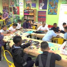 Youth work in Maker Space making lego projects in Springfield