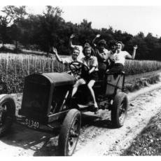 Women Students on Farm Vehicle