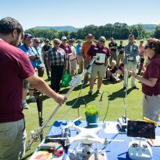 Dr. Michelle DaCosta, Turf Physiologist, and graduate student Jeff Lu demonstrate some of the equipment used in research at the Center