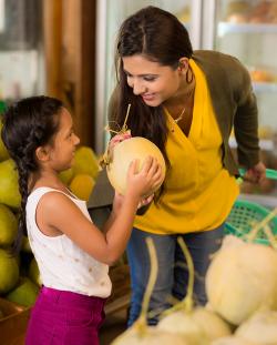 woman and child buying fruit