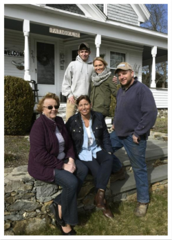 Image (Source: Herald News): A family photo of the Baker Farm in front of their farm house that was built in 1900.