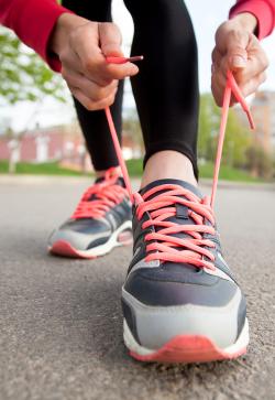 lacing up sneakers