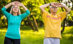 older couple doing tai chi