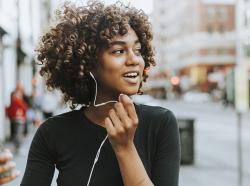 woman walking with headphones