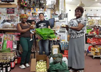 Zoraia Barros,UMass Amherst with latest produce at Worcester's Monrovia African Market