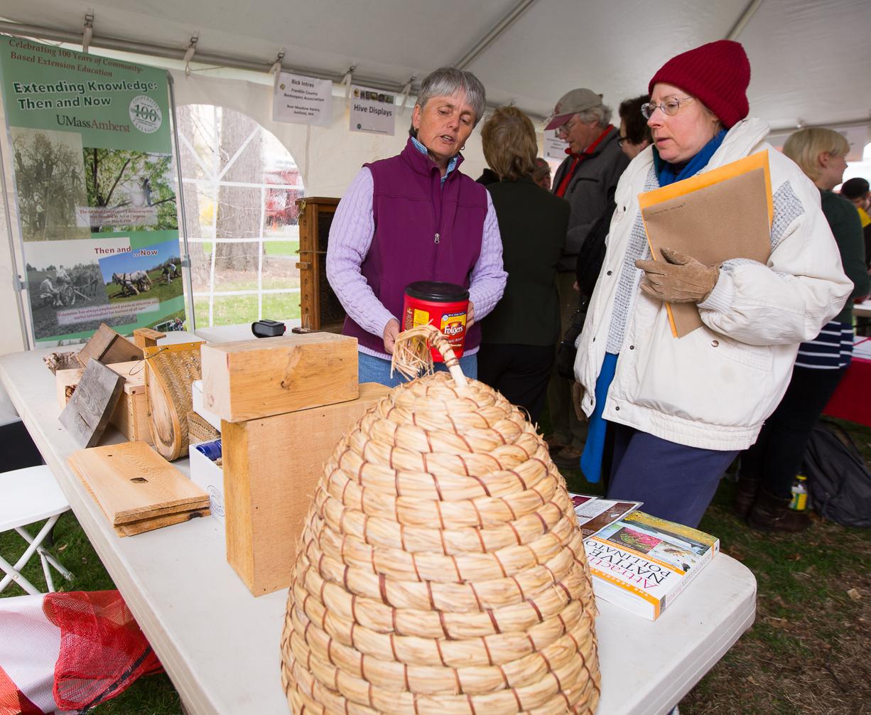 Sonia Schloemann, Extension Educator and Fruit Specialist, educates visitors about beehive choices.